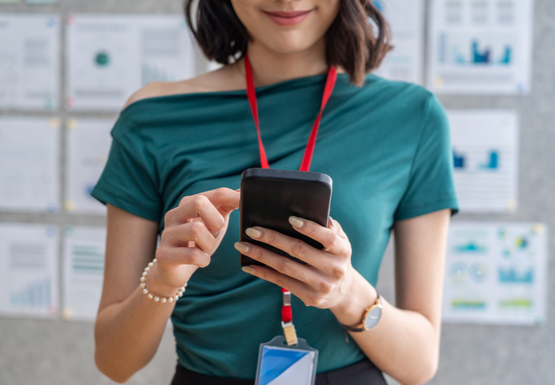 Woman holding her cell phone